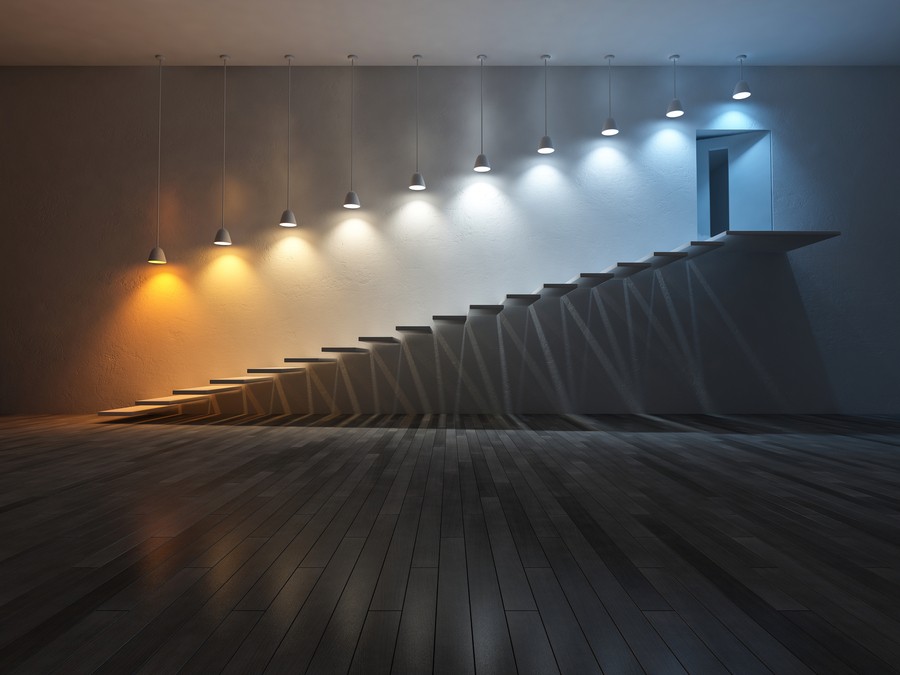 A series of lamps with different color temperatures illuminating a staircase. 