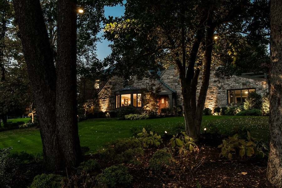 A luxurious home illuminated by WAC lighting outdoor solutions.