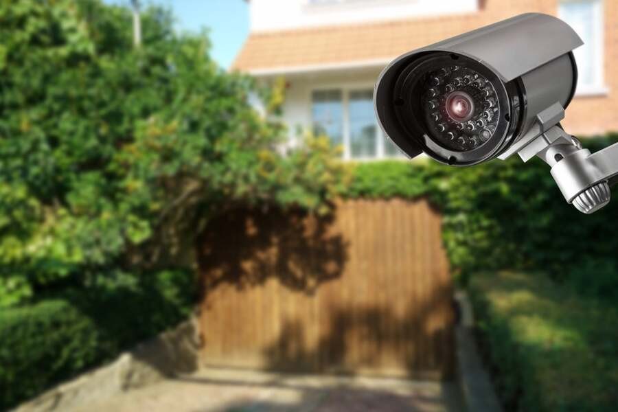 A surveillance camera overlooking a home.